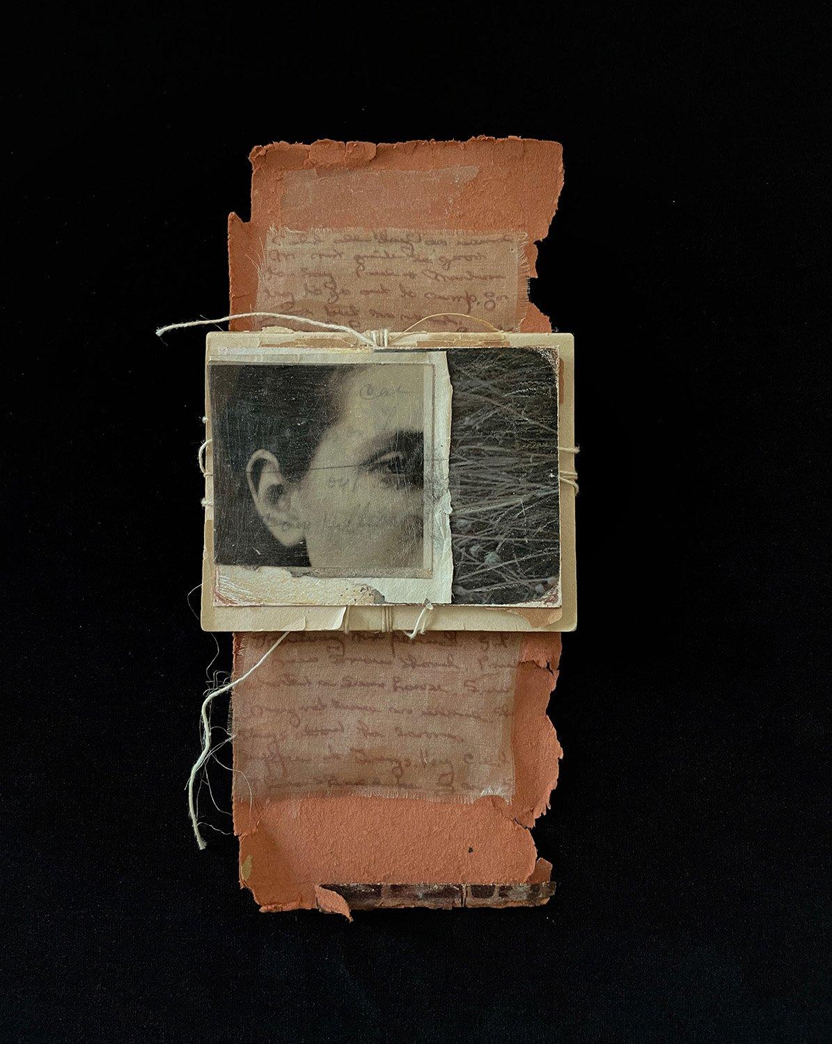 Photo assemblage by Dawn Surratt. Close up of a woman's eye juxtaposed with a detail shot of dried grass, handwriting, torn paper, sown to hold together.